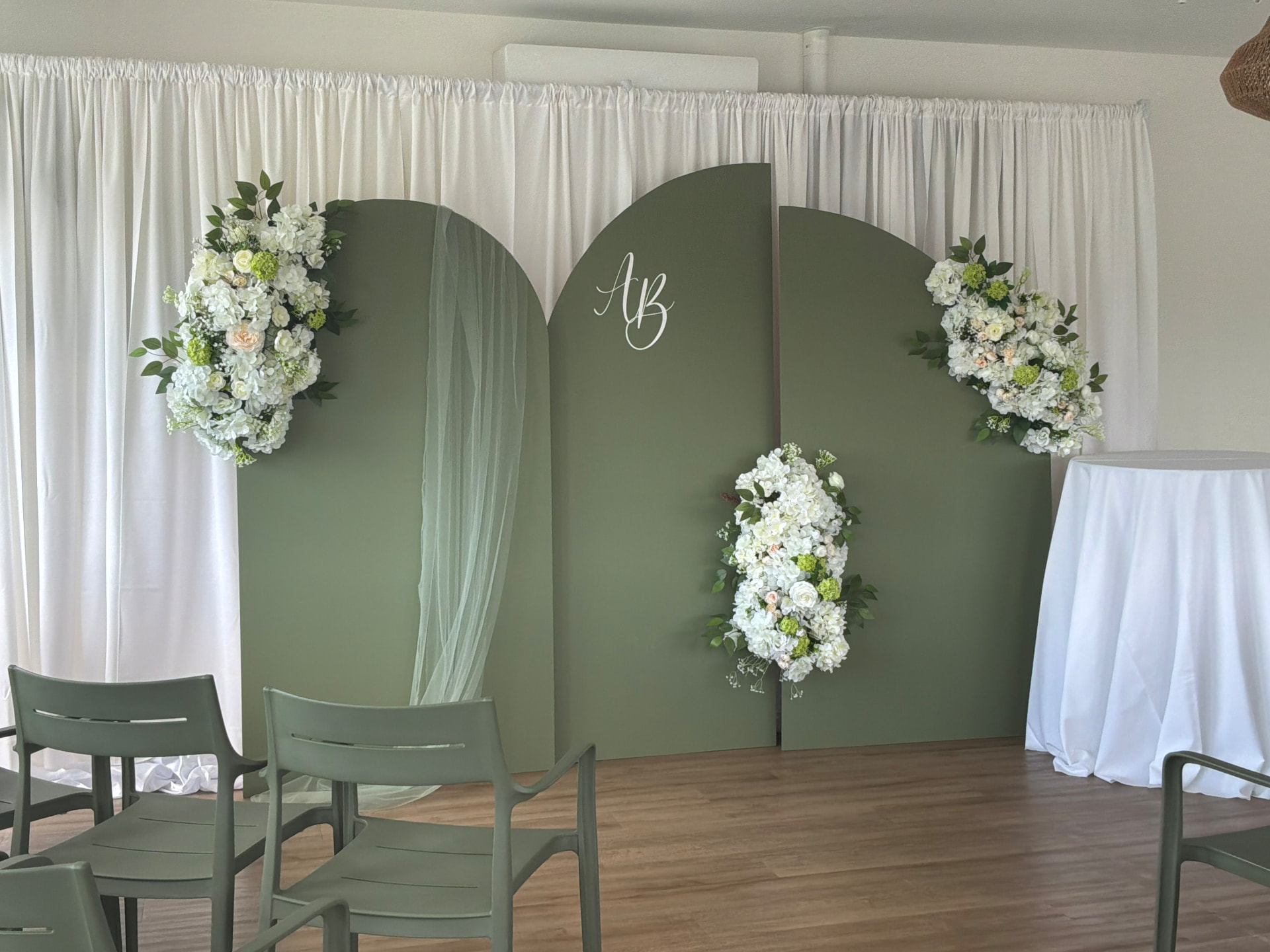 Sage wedding backdrop with florals